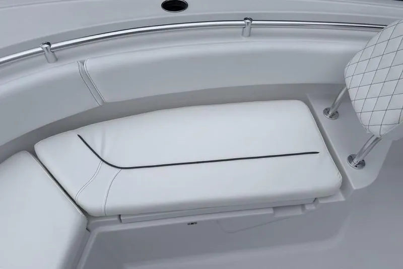 Slide: The Image of 2026 Sportsman Heritage 231 Center Console boat seating with white cushioned upholstery. - 7