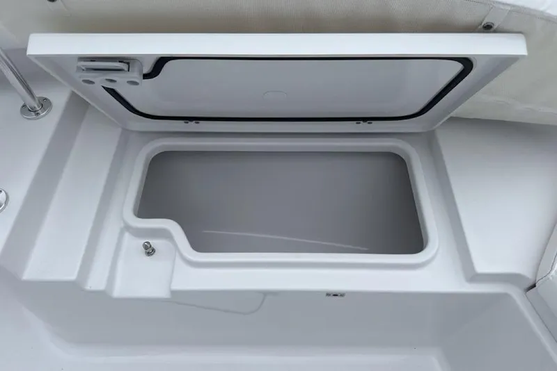 Slide: The Image of Open storage compartment on 2026 Sportsman Heritage 231 Center Console boat. - 9