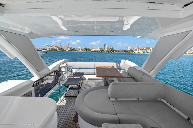 Slide: The Image of Luxurious 2019 Sunseeker Manhattan 66 yacht interior with ocean view and modern seating. - 10