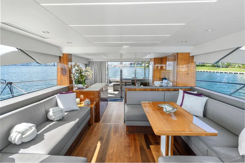 Slide: The Image of Luxurious interior of 2019 Sunseeker Manhattan 66 yacht with elegant seating and scenic water views. - 16