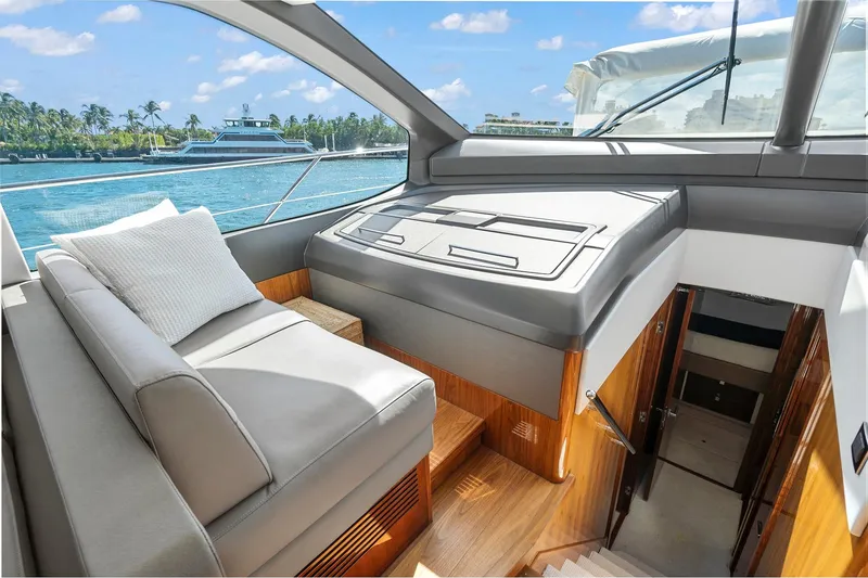 Slide: The Image of Luxurious interior of 2019 Sunseeker Manhattan 66 yacht with elegant seating and scenic ocean view. - 17