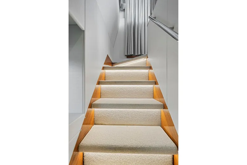 Slide: The Image of Staircase with carpeted steps and modern lighting on Sunseeker Manhattan 66 yacht, 2019. - 19