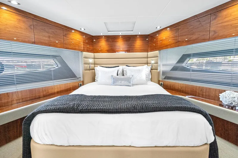 Slide: The Image of Luxurious bedroom interior of 2019 Sunseeker Manhattan 66 yacht with elegant wood finishes. - 20