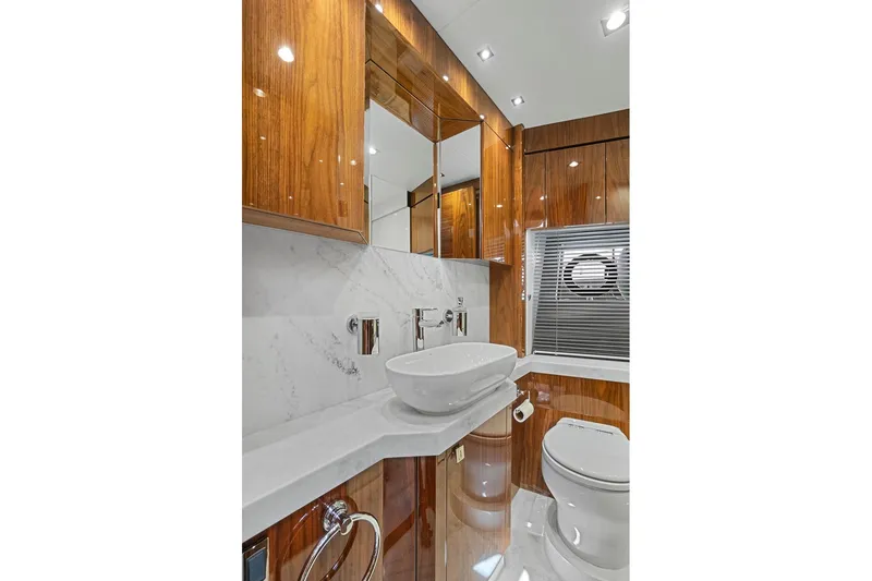 Slide: The Image of Luxurious bathroom in 2019 Sunseeker Manhattan 66 yacht with wood accents and modern fixtures. - 26