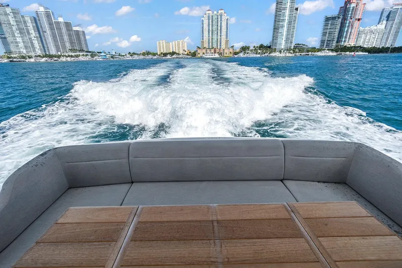Slide: The Image of Sunseeker Manhattan 66 yacht cruising with city skyline in the background, 2019 model. - 3