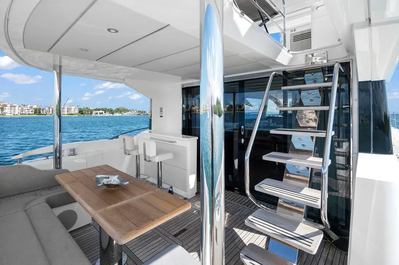 Slide: The Image of Luxurious 2019 Sunseeker Manhattan 66 yacht interior with modern seating and ocean view. - 6