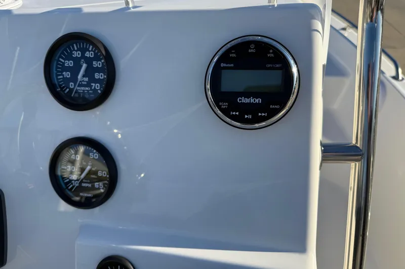 Slide: The Image of Dashboard of 2026 Key West 1720 Center Console with gauges and Clarion audio system. - 15