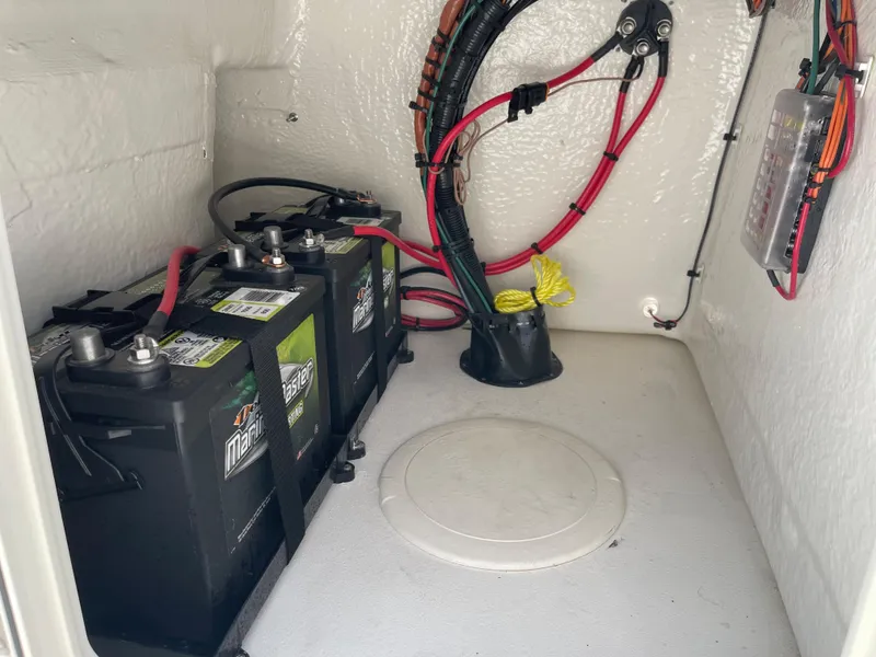 Slide: The Image of 2025 Key West 1720 Center Console boat battery compartment with wiring. - 16
