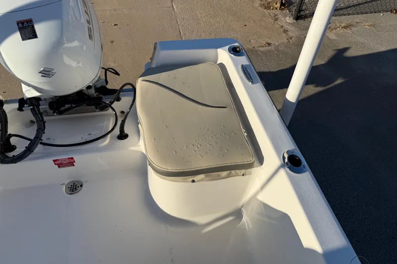 Slide: The Image of 2026 Key West 1720 Center Console boat with Suzuki outboard motor, rear seating area. - 25