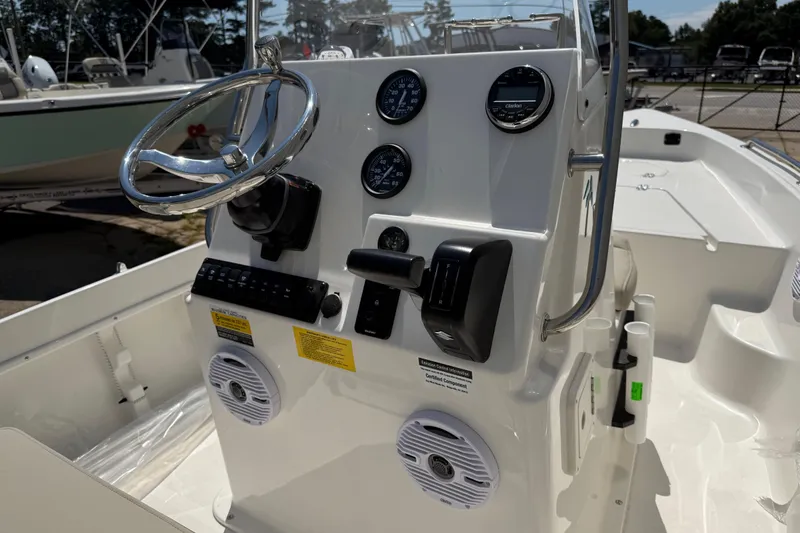 Slide: The Image of 2026 Key West 1720 Center Console boat interior with cushioned seating and storage. - 7