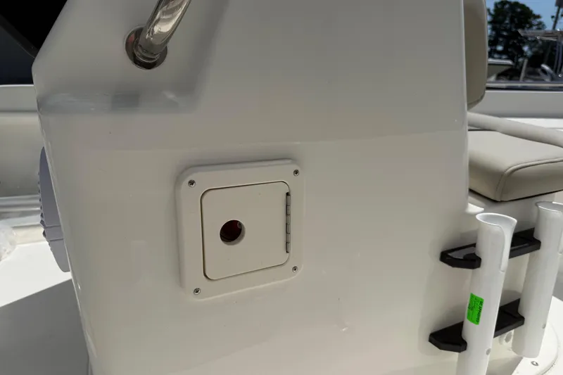 Slide: The Image of 2025 Key West 1720 Center Console boat, spacious deck view, parked outdoors. - 9