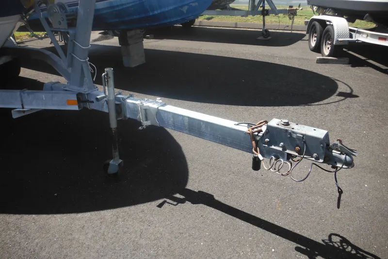 Slide: The Image of Trailer hitch of a 2011 Sea Ray 205 Sport boat on asphalt. - 13