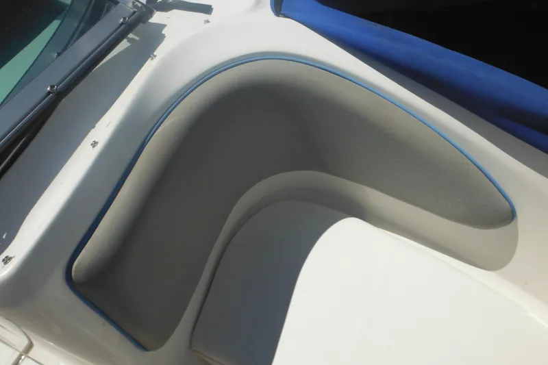 Slide: The Image of 2011 Sea Ray 205 Sport boat interior with blue and gray seating detail. - 24