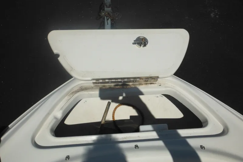Slide: The Image of Open storage compartment on 2011 Sea Ray 205 Sport boat, showing interior details. - 27