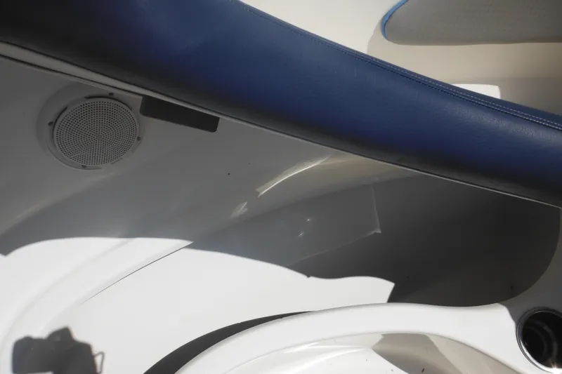 Slide: The Image of Interior of 2011 Sea Ray 205 Sport boat showing speaker and seating area. - 29
