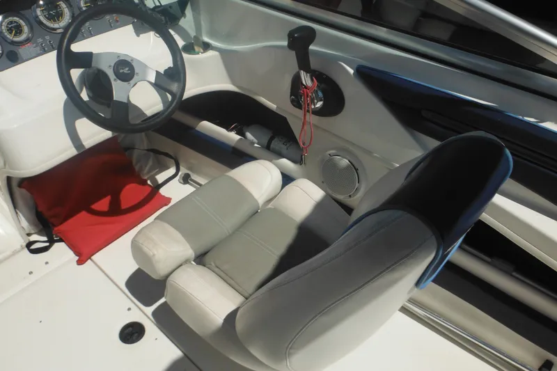 Slide: The Image of Interior of 2011 Sea Ray 205 Sport boat with steering wheel and seat. - 32