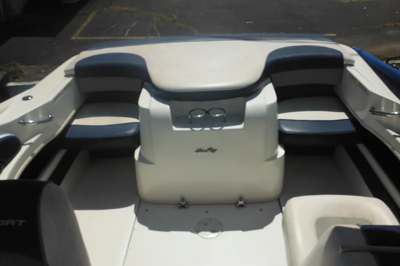 Slide: The Image of 2011 Sea Ray 205 Sport boat interior with cushioned seating and cup holders. - 39