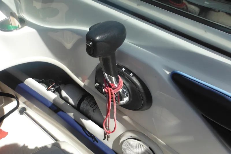 Slide: The Image of Throttle control of a 2011 Sea Ray 205 Sport boat with red lanyard attached. - 46