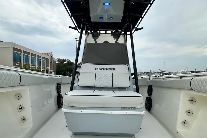 Slide: The Image of 1999 Contender 23 Open boat interior with cushioned seating and modern design. - 23