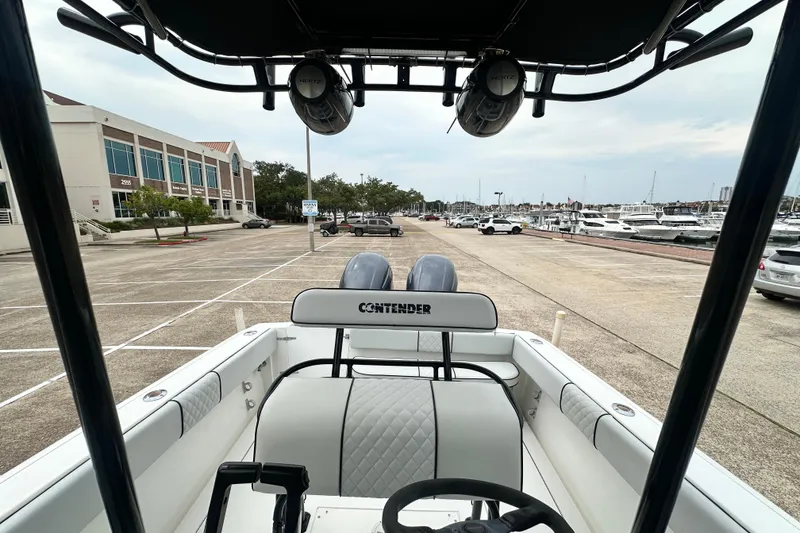 Slide: The Image of 1999 Contender 23 Open boat interior at marina parking, view towards docks. - 27