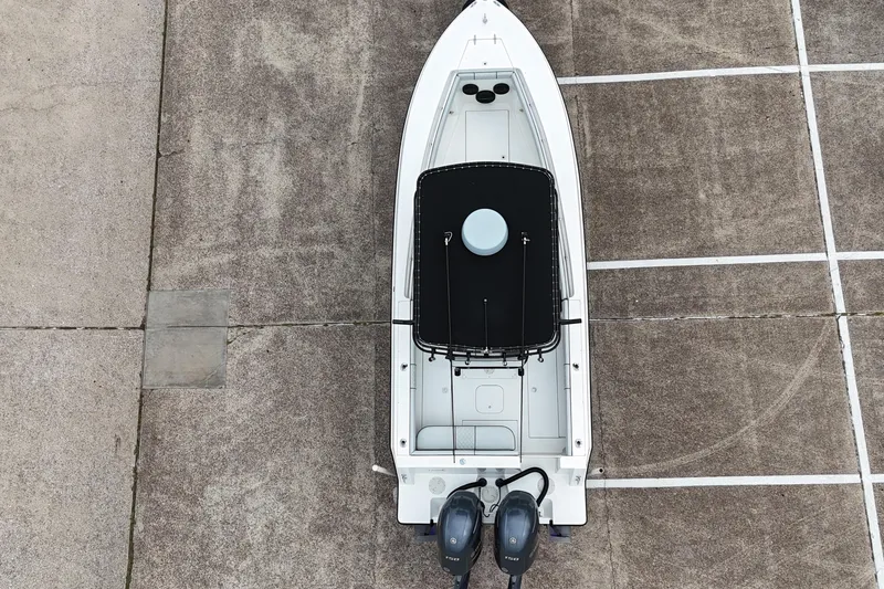Slide: The Image of Aerial view of 1999 Contender 23 Open boat on concrete surface. - 5