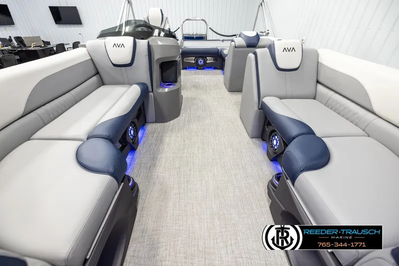 Slide: The Image of 2026 Avalon LSZ VRB boat interior with luxurious seating and ambient blue lighting. - 13