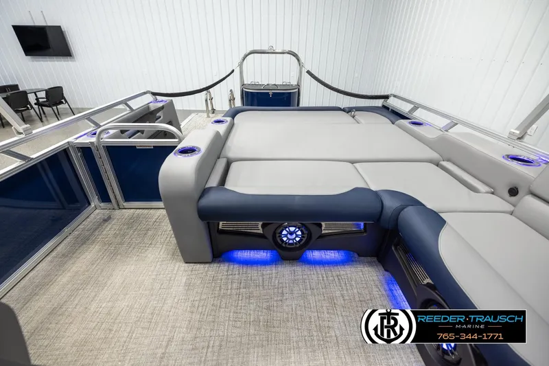 Slide: The Image of 2026 Avalon LSZ VRB pontoon boat interior with luxurious seating and ambient blue lighting. - 15