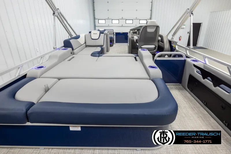 Slide: The Image of 2026 Avalon LSZ VRB pontoon boat interior with plush seating and modern design. - 16