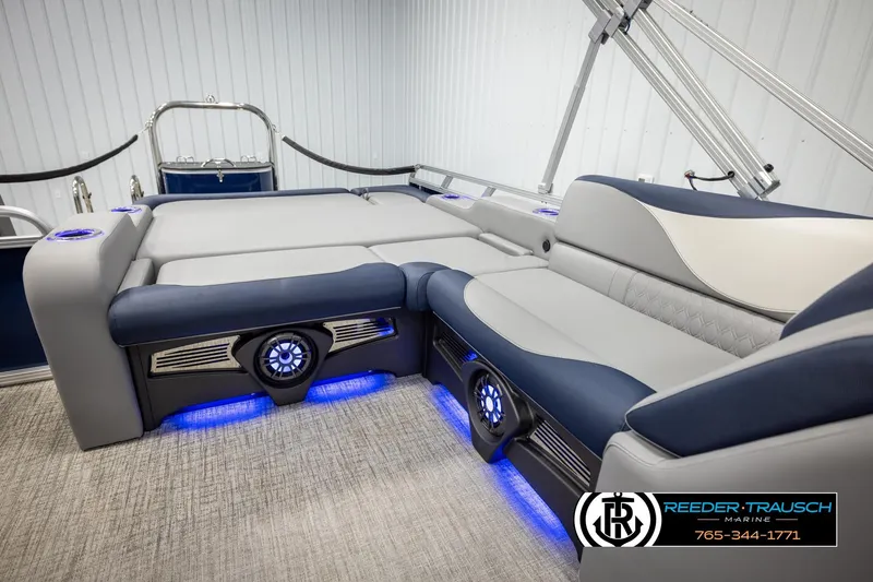 Slide: The Image of Luxurious 2026 Avalon LSZ VRB boat interior with plush seating and ambient blue lighting. - 24