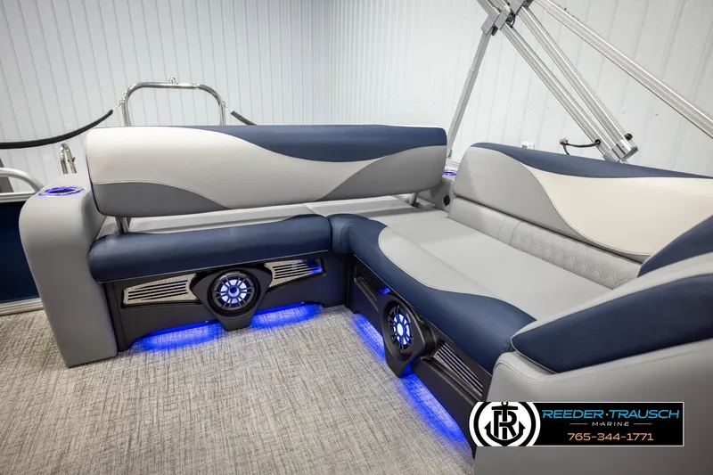 Slide: The Image of Luxurious 2026 Avalon LSZ VRB boat interior with blue LED lighting and plush seating. - 27
