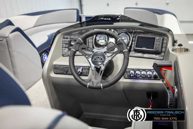 Slide: The Image of 2026 Avalon LSZ VRB boat dashboard with steering wheel and navigation controls. - 28