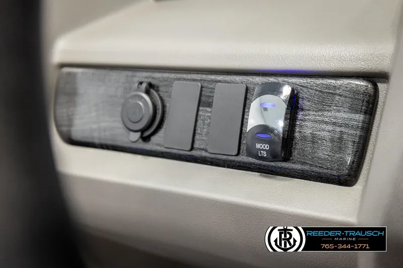 Slide: The Image of Control panel of 2026 Avalon LSZ VRB with mood lighting switch, Reeder-Trausch Marine branding. - 31