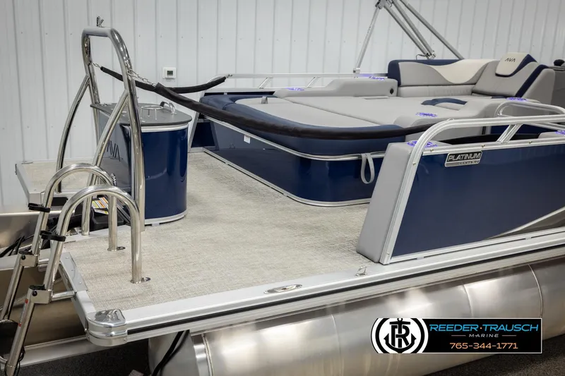 Slide: The Image of 2026 Avalon LSZ VRB pontoon boat with luxurious seating and sleek design in showroom. - 49