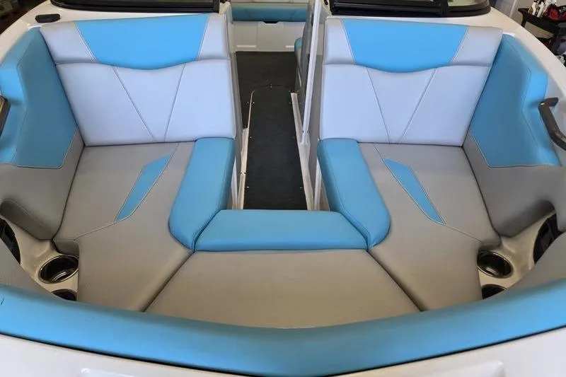 Slide: The Image of 2020 MasterCraft NXT20 boat interior with blue and gray seating. - 10