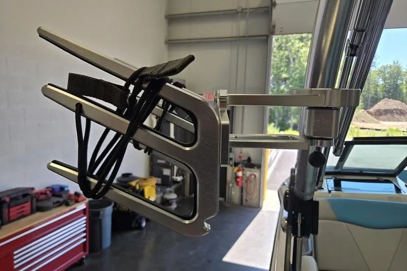 Slide: The Image of 2020 MasterCraft NXT20 boat wakeboard rack in a garage setting. - 12