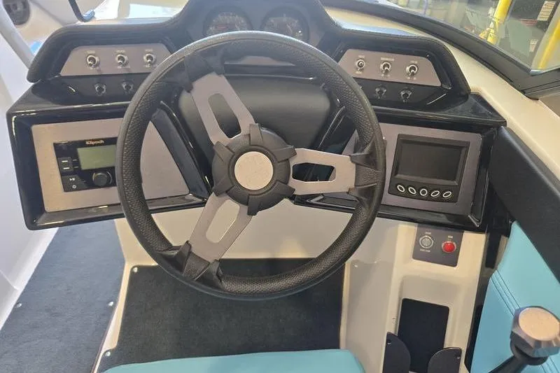 Slide: The Image of 2020 MasterCraft NXT20 boat dashboard with steering wheel and control panel. - 4