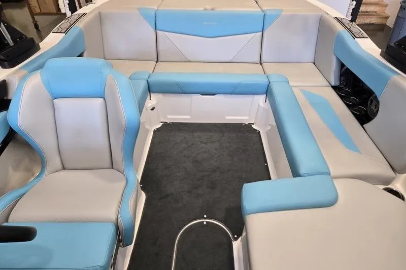 Slide: The Image of 2020 MasterCraft NXT20 boat interior with blue and gray seating arrangement. - 5