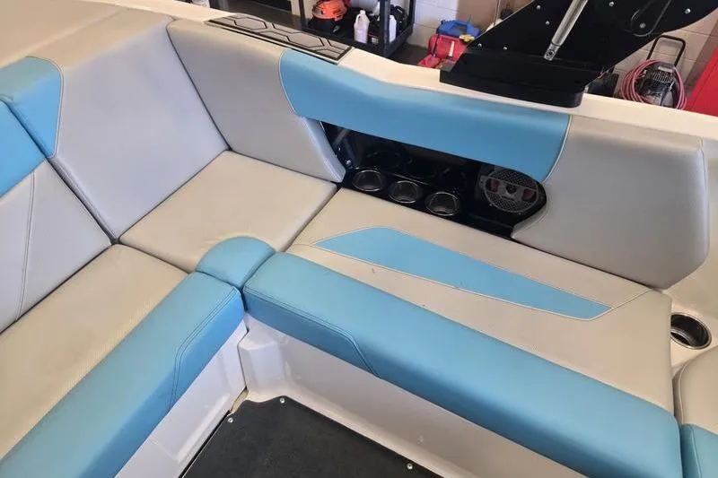 Slide: The Image of 2020 MasterCraft NXT20 boat interior with blue and gray seating. - 6