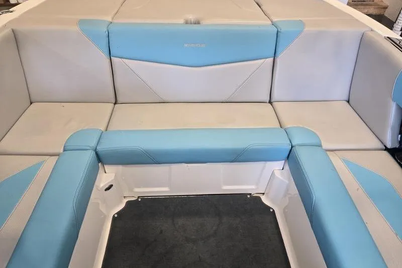 Slide: The Image of 2020 MasterCraft NXT20 boat interior with blue and gray seating. - 8