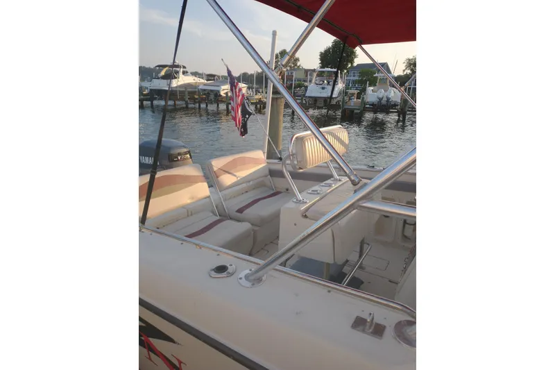 Slide: The Image of 1990 Donzi F-33 boat interior with seating, docked at marina. - 6