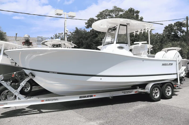 The Image of 2026 Regulator 25 boat on trailer, sleek design, ready for adventure. - 0