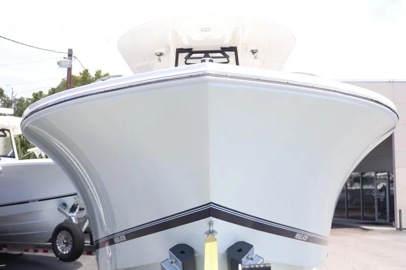 Slide: The Image of 2026 Regulator 25 boat front view, showcasing sleek design and modern features. - 12