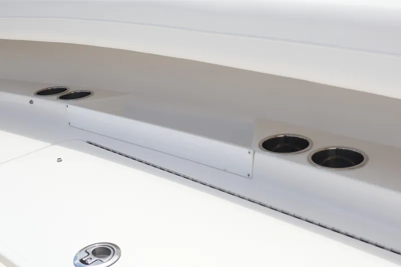 Slide: The Image of 2026 Regulator 25 boat interior with cup holders and sleek design. - 15