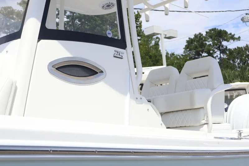 Slide: The Image of 2026 Regulator 25 boat with sleek design and comfortable seating. - 2
