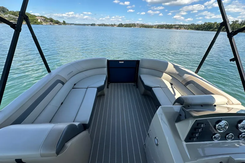 Slide: The Image of 2023 Viaggio 22U pontoon boat interior with spacious seating on a serene lake. - 17