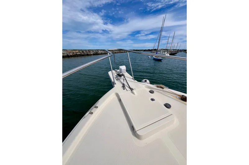 Slide: The Image of 2005 Mainship Pilot 30-II boat deck with ocean view and moored sailboats. - 29