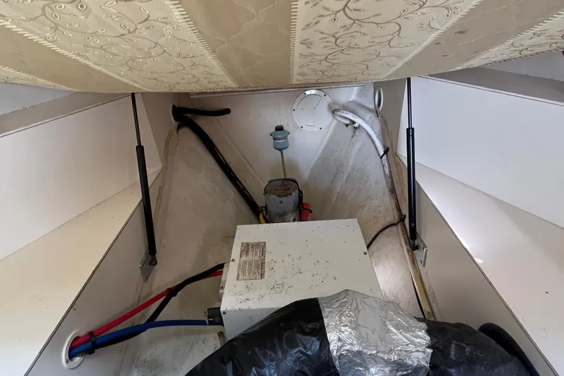 Slide: The Image of 2005 Mainship Pilot 30-II engine compartment with wiring and equipment. - 45