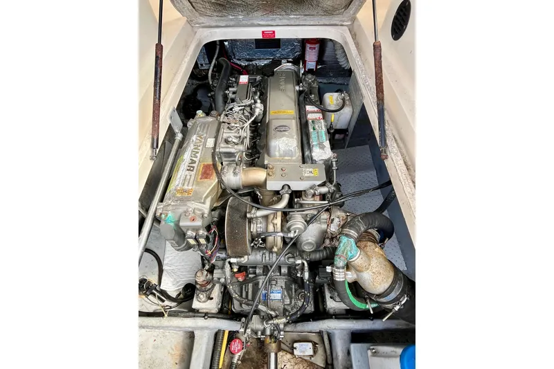 Slide: The Image of Engine compartment of a 2005 Mainship Pilot 30-II, featuring a Yanmar marine engine. - 50