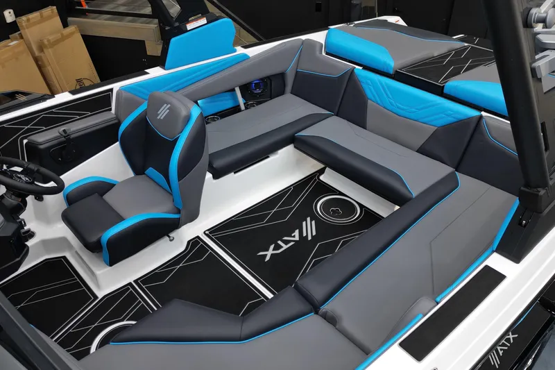 Slide: The Image of 2026 ATX Surf Boats 22 Type-S interior with blue and gray seating. - 12