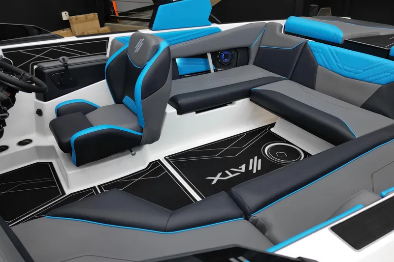 Slide: The Image of 2026 ATX Surf Boats 22 Type-S interior with sleek black and blue seating design. - 13